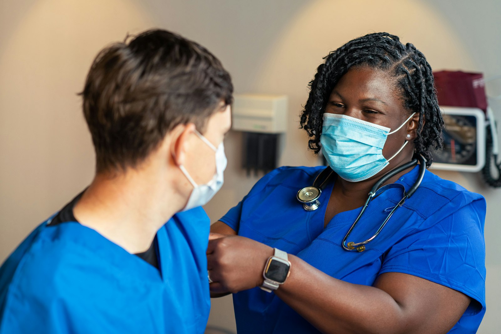 Two clinical staff members working side by side
